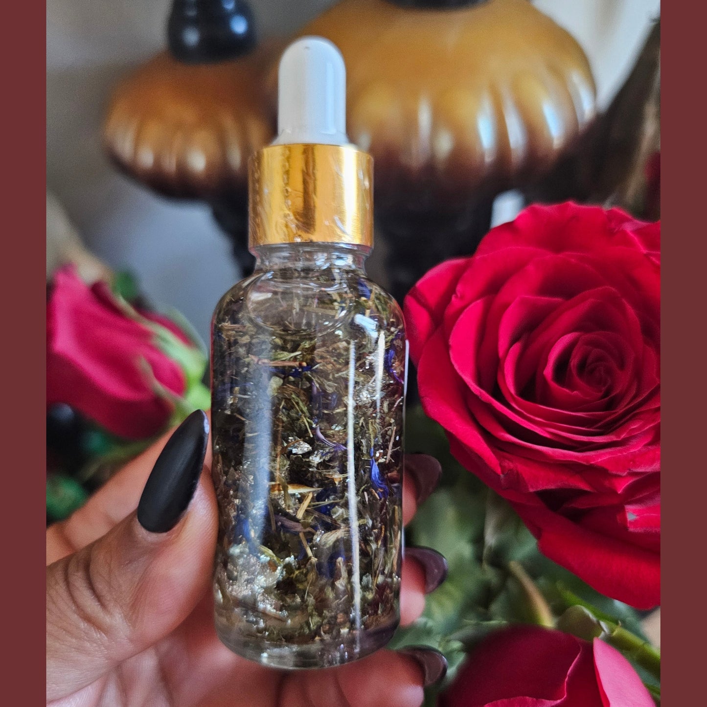 2 ounce glass dropper bottle Blockbuster Open Roads Conjure Oil back side with roses