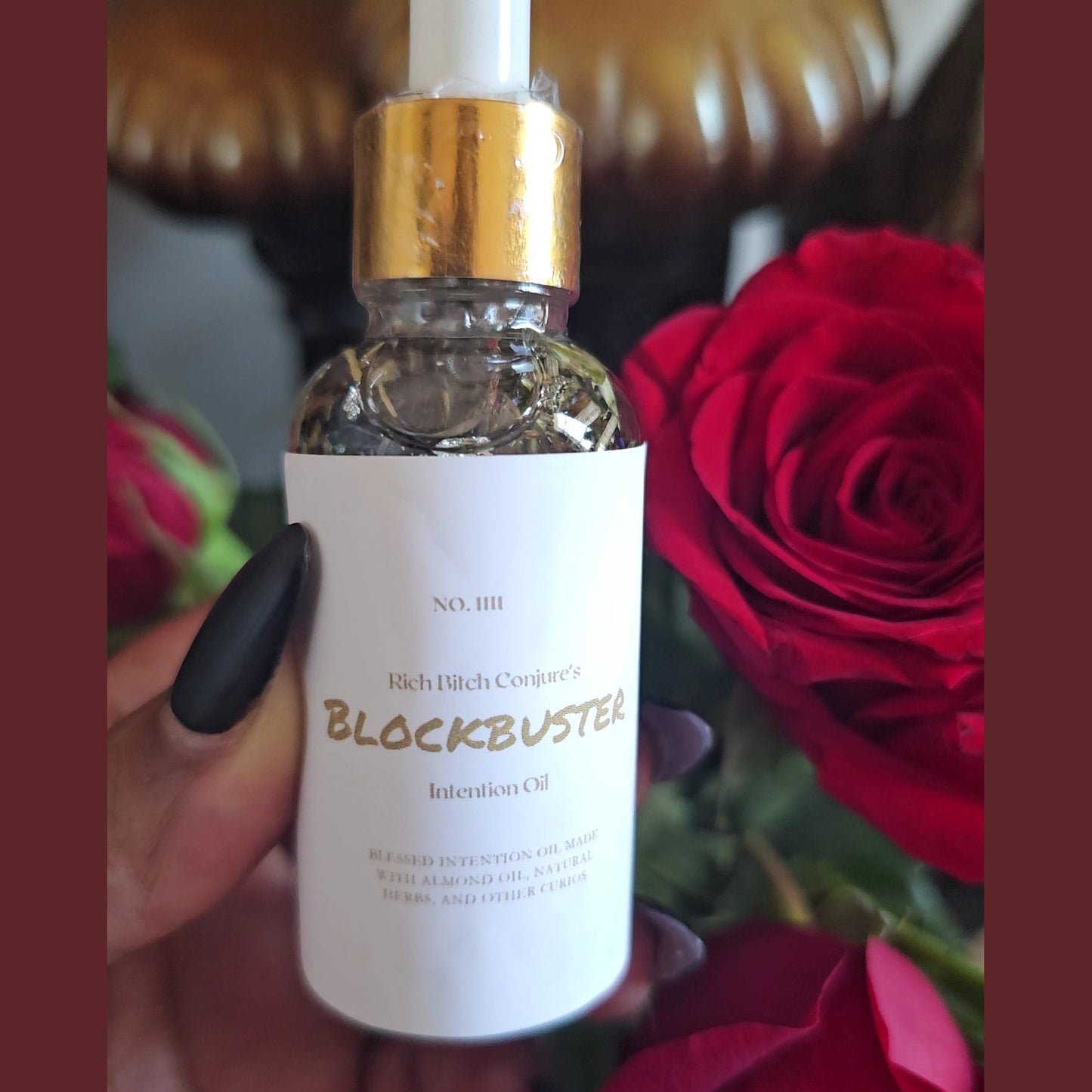 2 ounce glass dropper bottle Blockbuster Open Roads Conjure Oil front side with label and roses