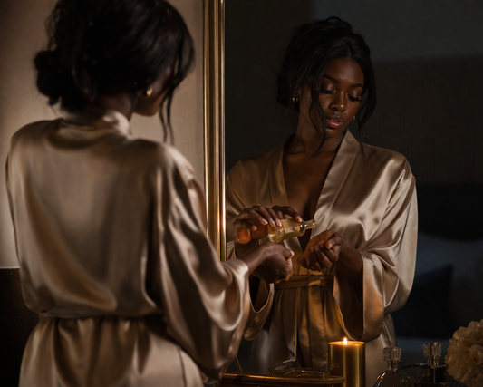 Black woman performing a daily spiritual boundary ritual with conjure oil in a luxury setting