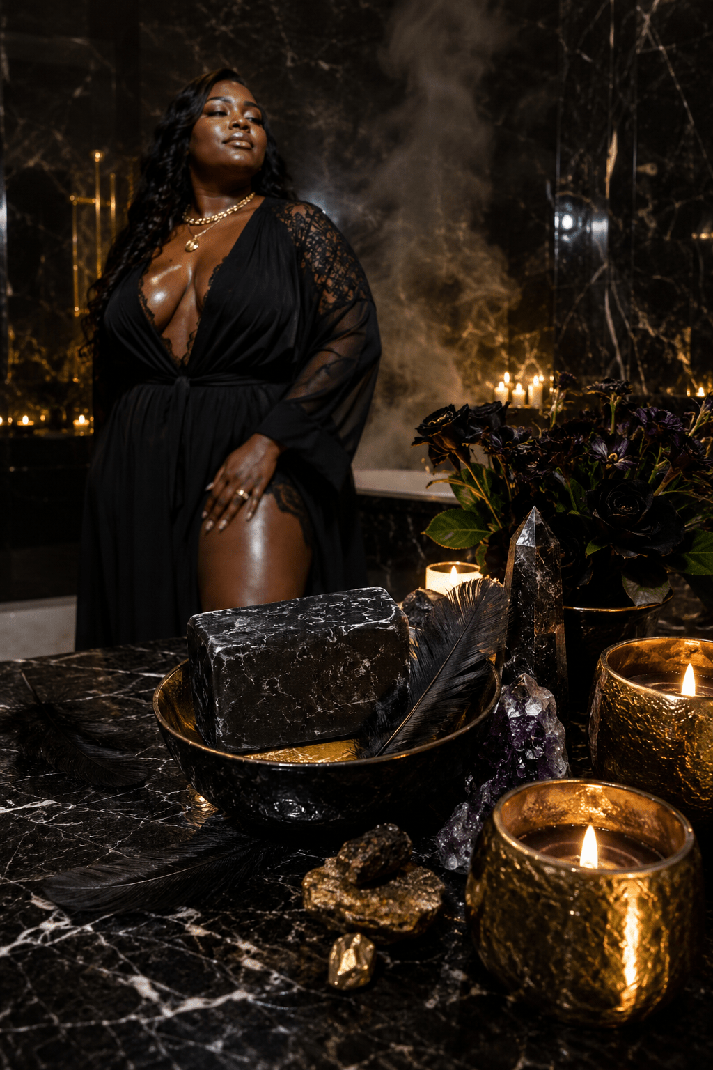 Woman in a dark room with candles, crystals, and a black stone on a marble surface.