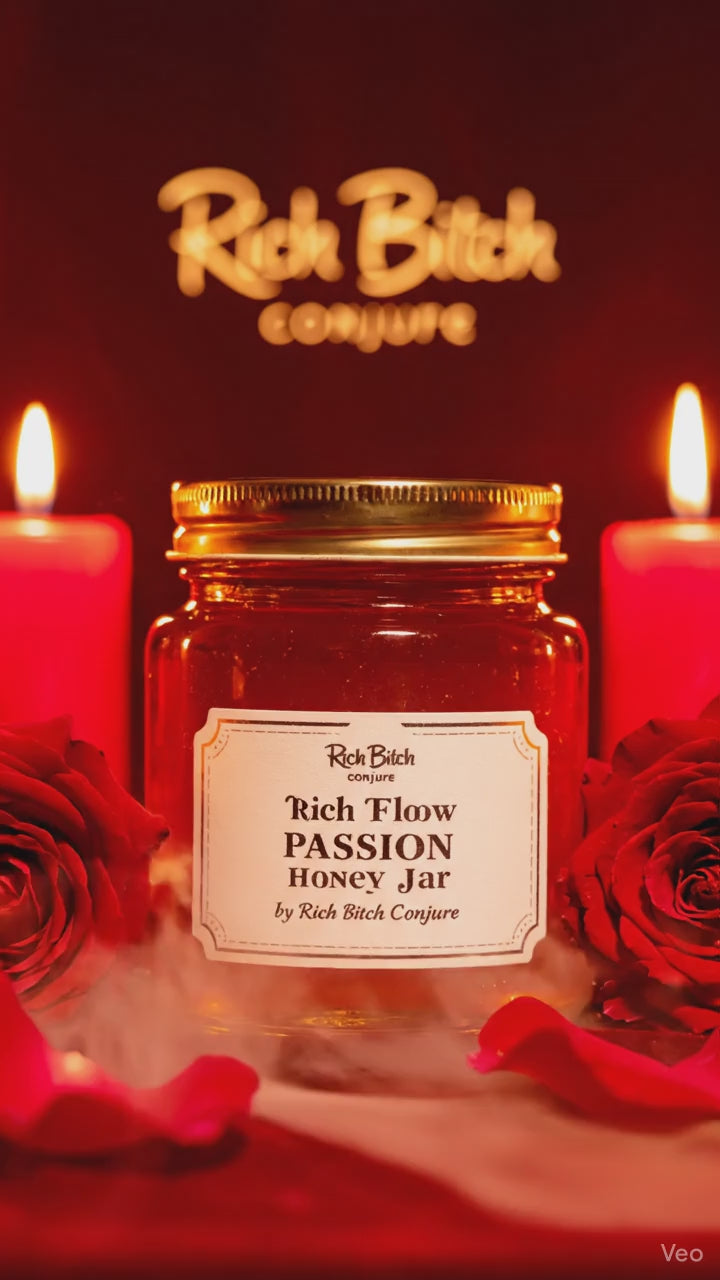 A sensual 4 oz Rich Flow Passion Honey Jar with a gold lid, red roses, and red candle lighting.